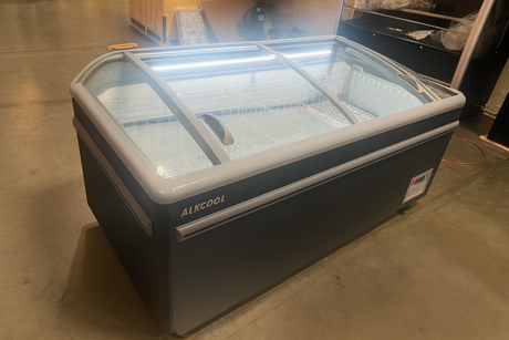 Commercial freezer with glass door and 'ALKCOOL' branding on a concrete floor.