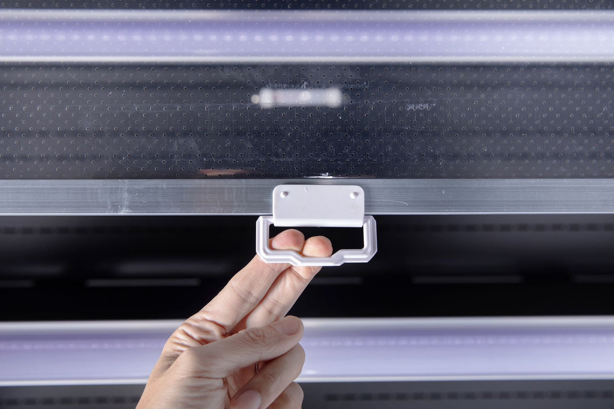 Black vertical commercial refrigerator with LED lighting and signage panel