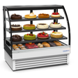 Display case with various types of cakes and pastries on a white background