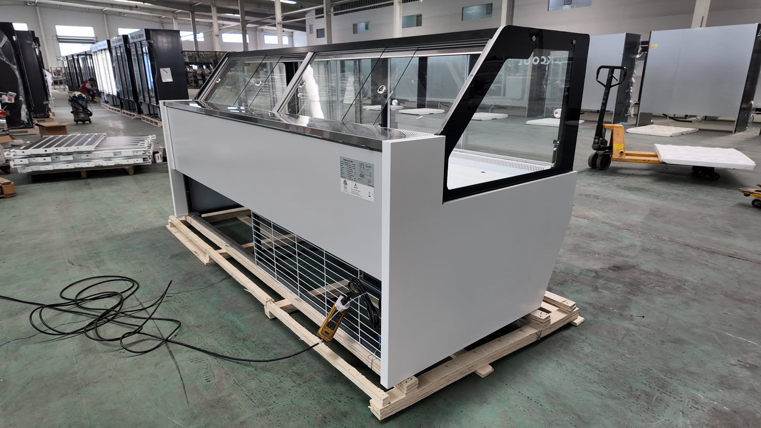 Refrigerated showcase case with tempered sliding glass and snap-on shelves.