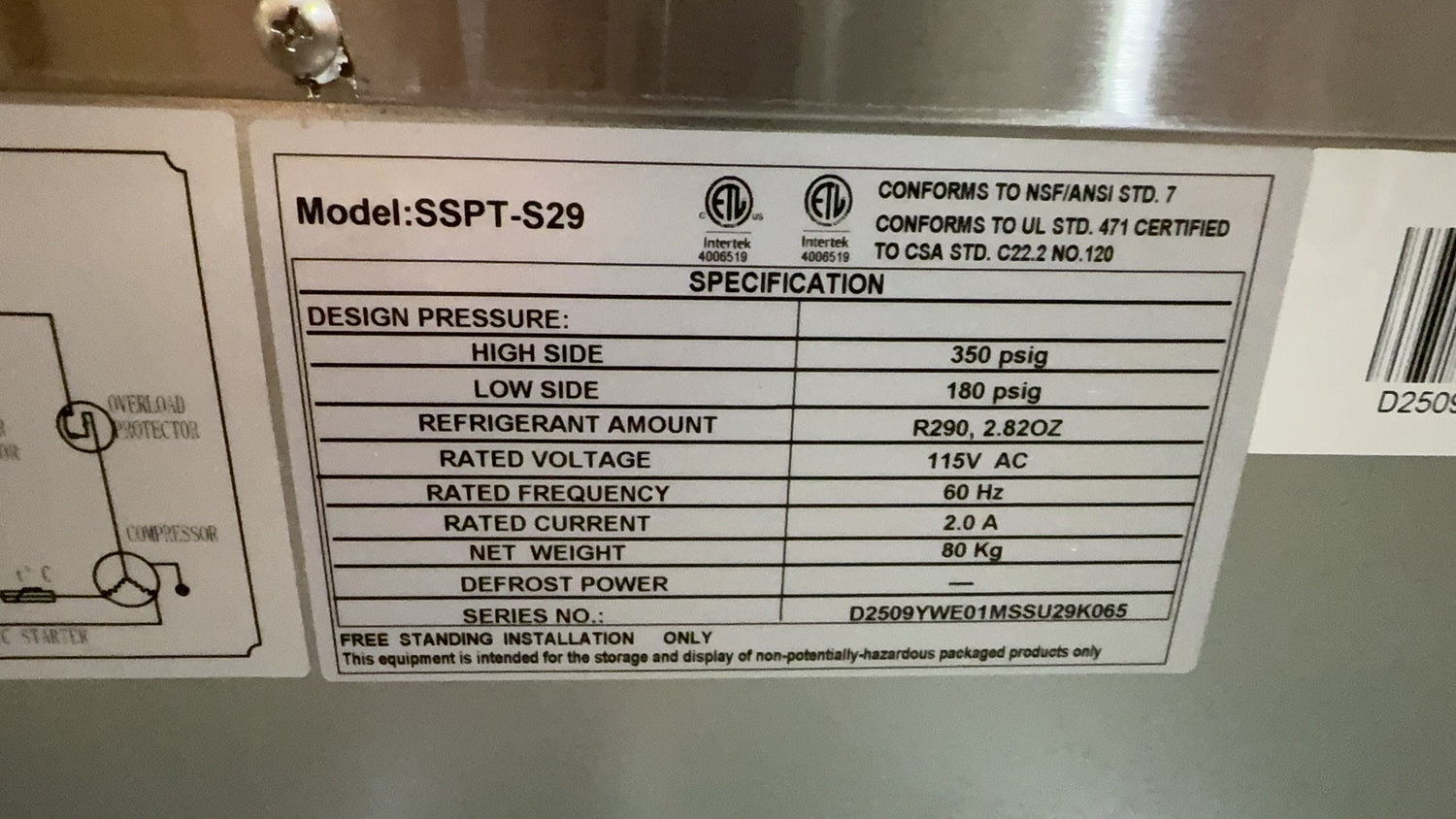 Technical label with specifications on a metallic surface