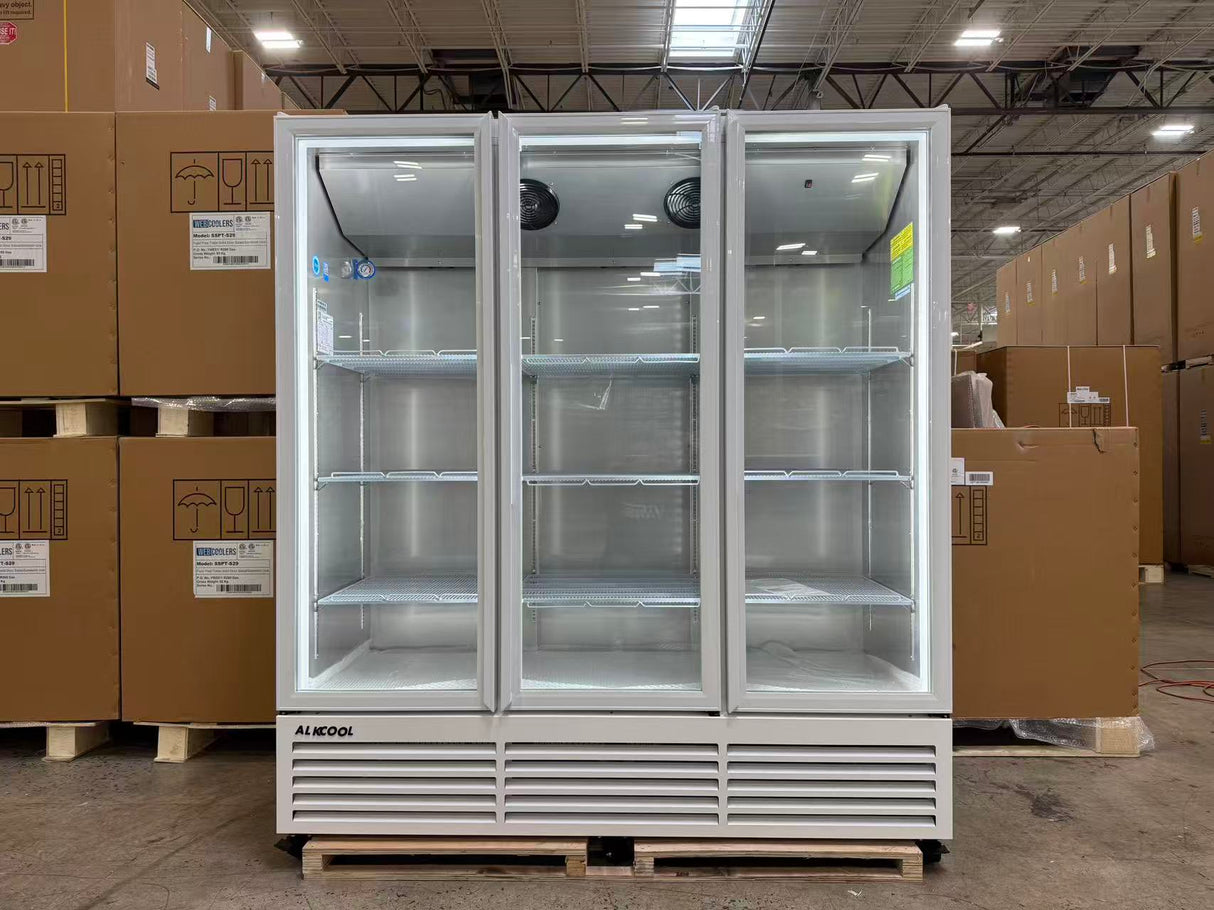Large industrial refrigerator in a warehouse setting with cardboard boxes around