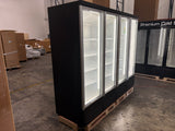 Large black refrigerator with glass doors in a warehouse setting