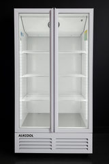White refrigerator with glass doors on a black background