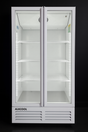 White refrigerator with glass doors on a black background