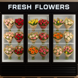 Display case with various bouquets of fresh flowers labeled 'Fresh Flowers'.