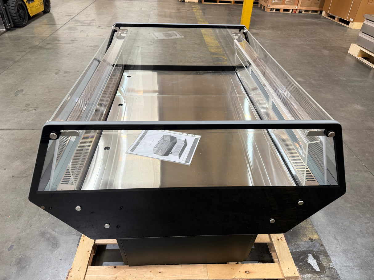 Large metal and glass structure on a pallet in an industrial setting