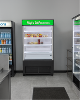 Refrigerated display case with 'Fresh & Cold Selections' sign in a store setting.