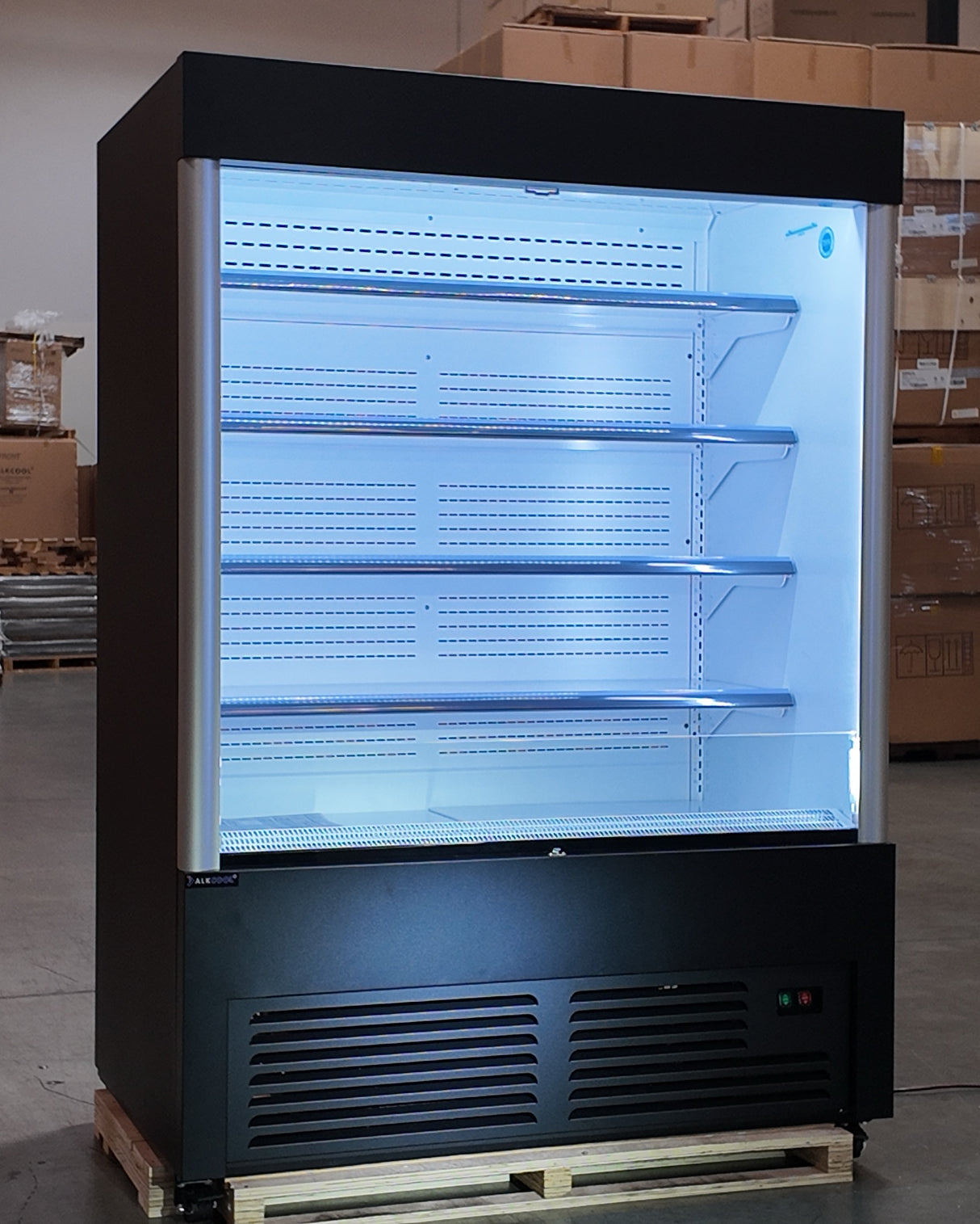Commercial refrigerator on a pallet in a warehouse setting