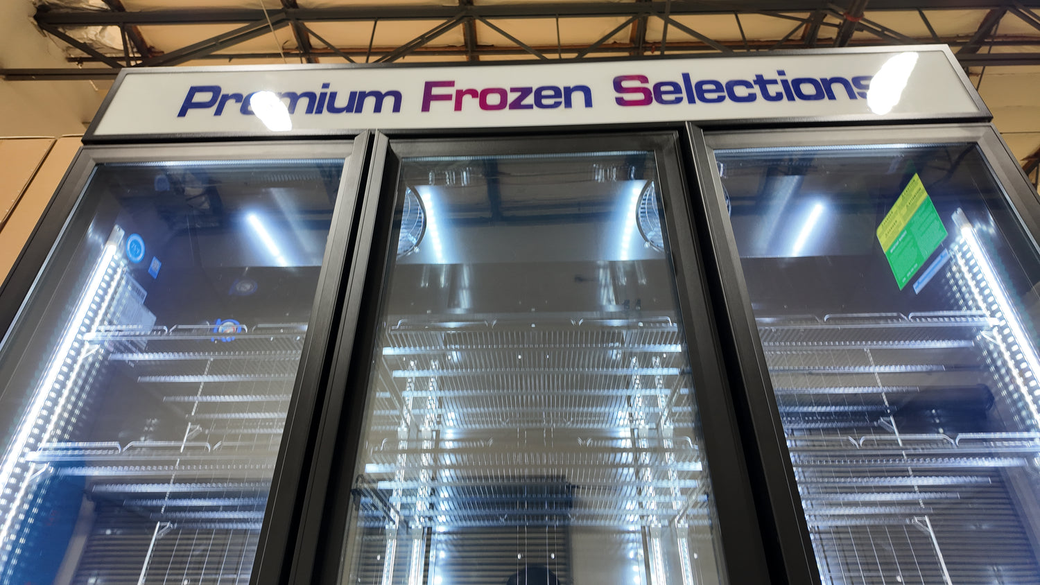 Commercial glass door freezer with black exterior and bright LED interior lights