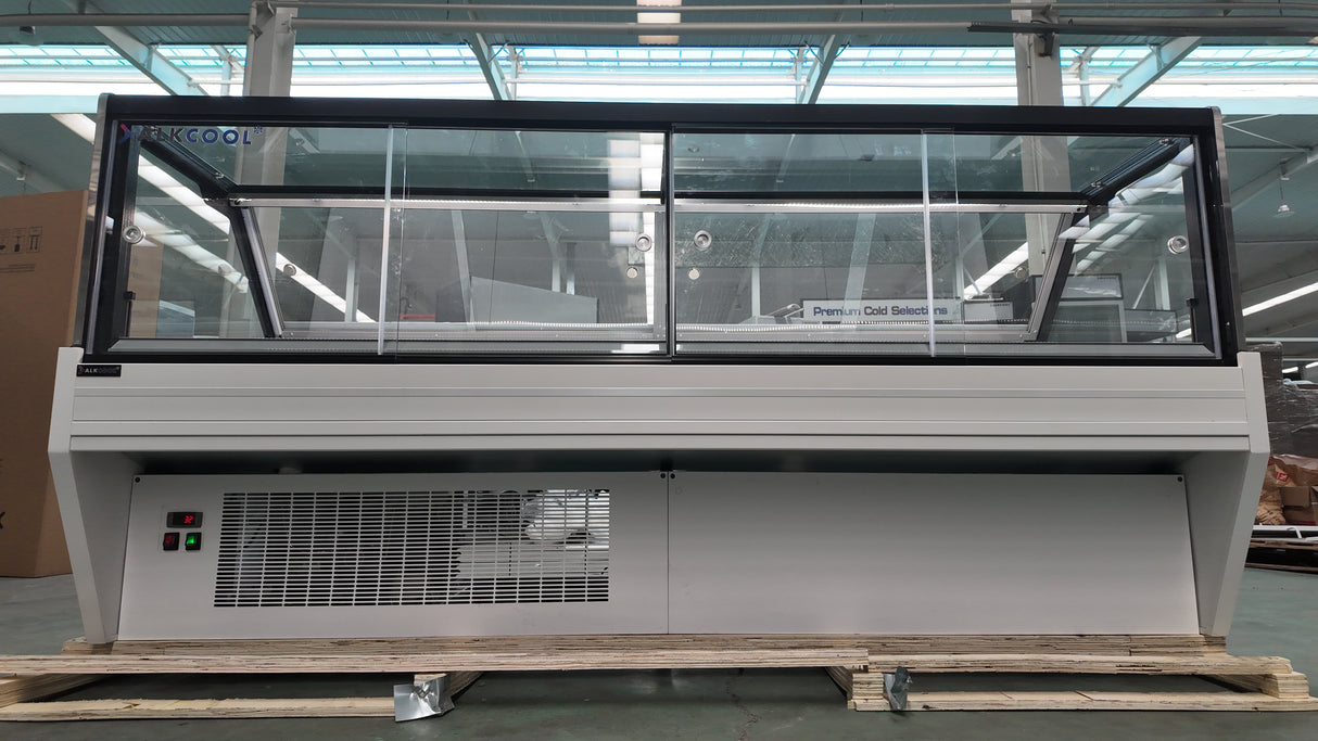 Bakery display refrigerated unit with LED lighting and tempered glass.