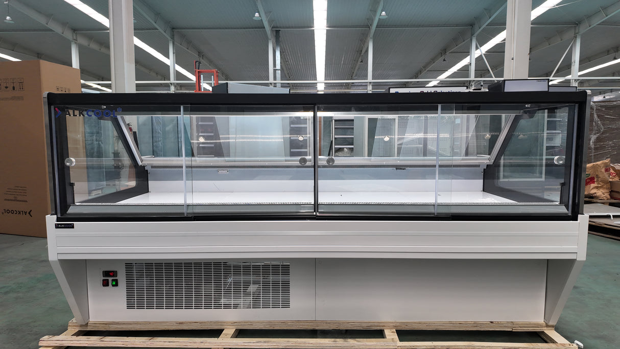 Refrigerated case with digital thermometer and electronic thermostat.